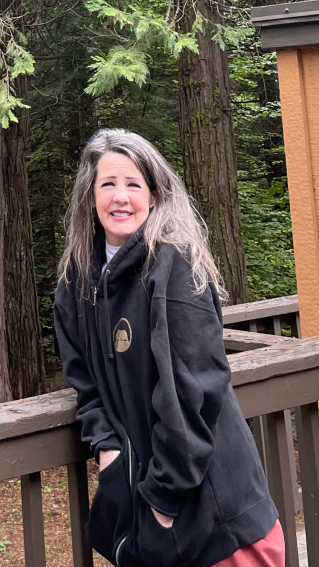 Woman in Black Sleeveless Top Wearing Pink Knit Cap